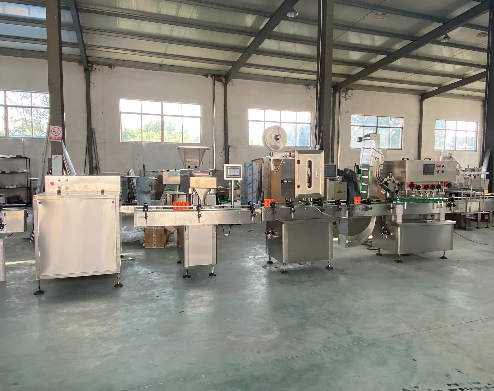 Complete packaging line turnkey solution in Zhenxing Machinery factory workshop